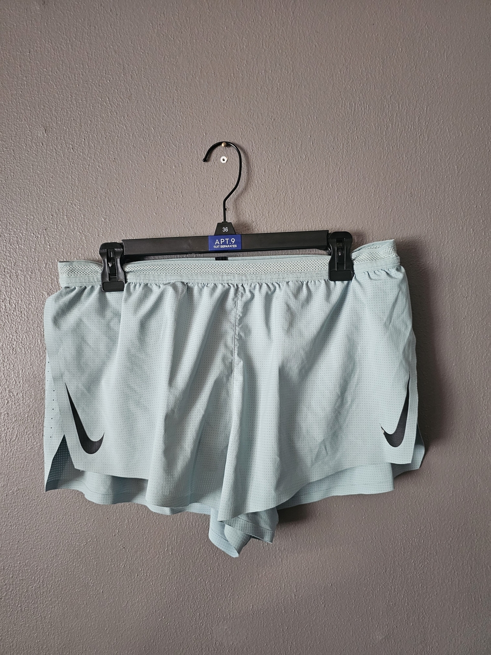 Nike Women's Light Aqua Athletic Running Shorts with Black Swoosh